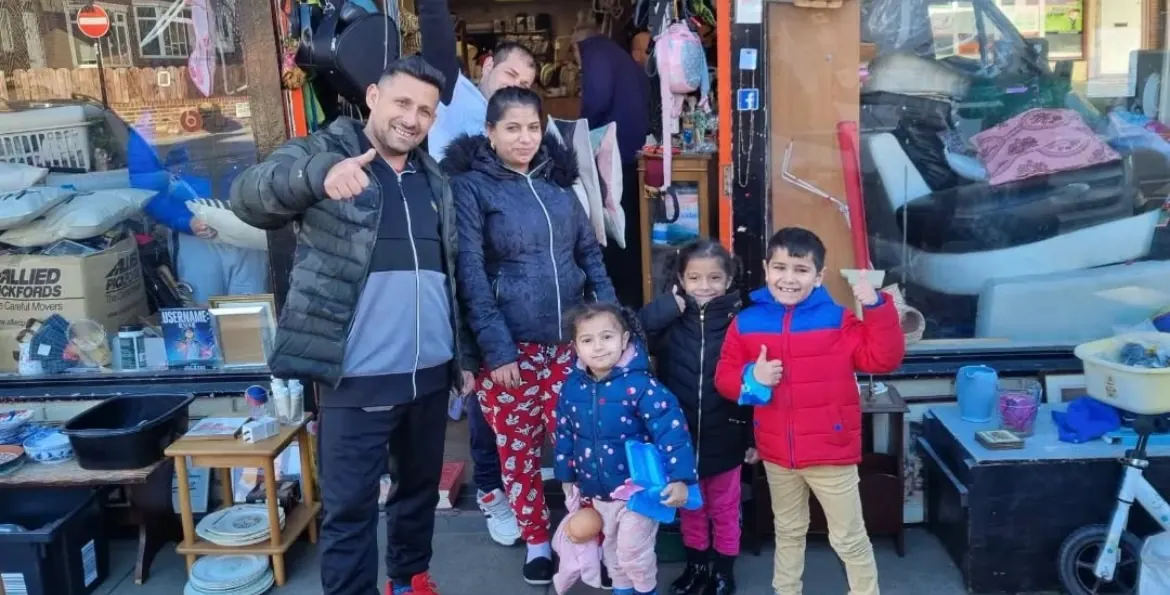 Happy family visiting The Angelical Den community store in Benwell