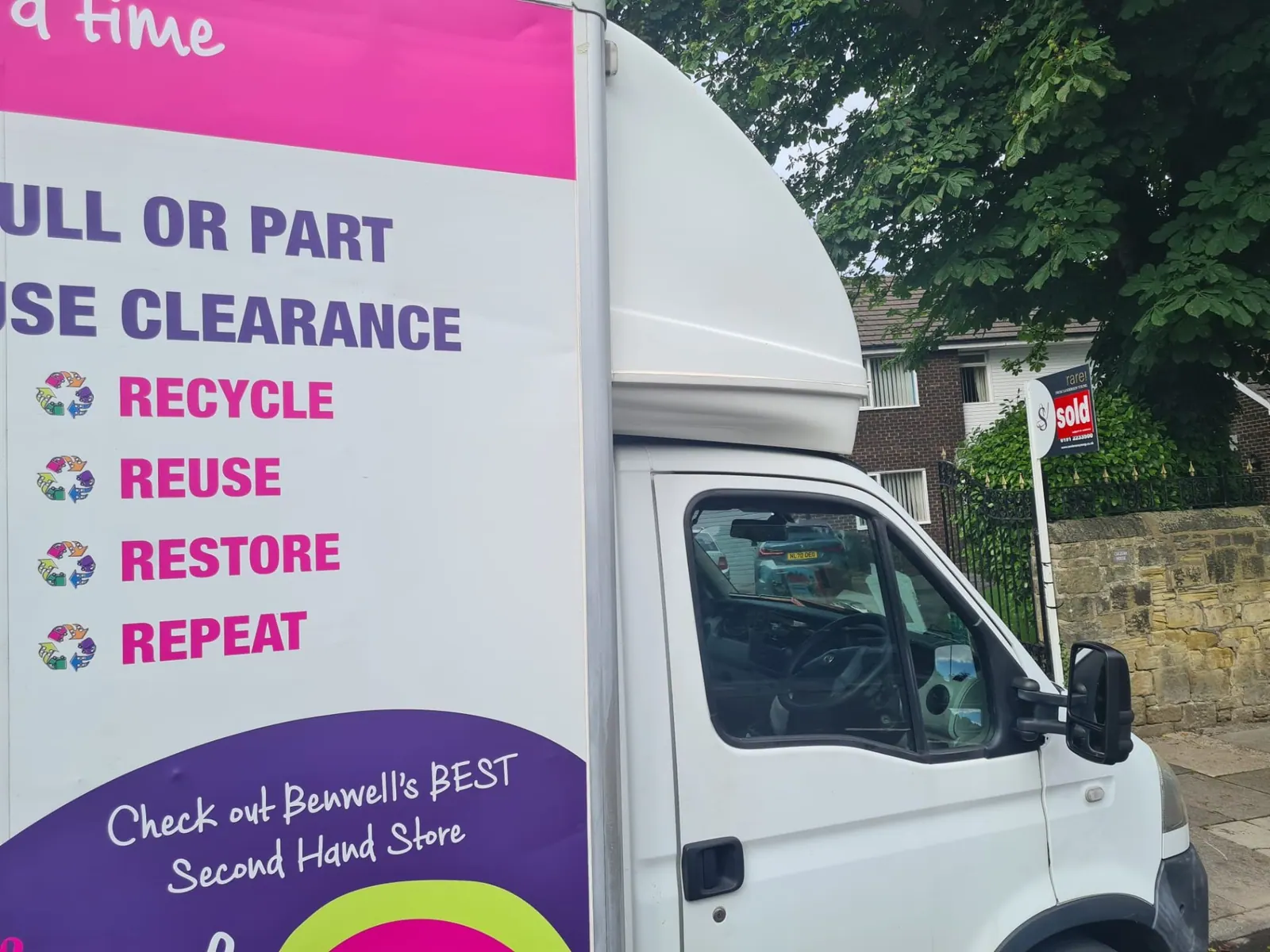 Close-up of the Angel House Clearance lorry branding