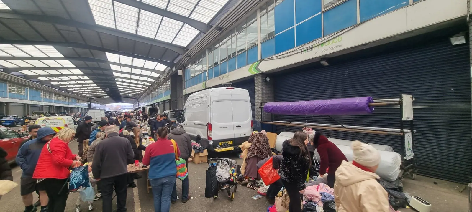 Busy market scene selling reusable items from house clearances