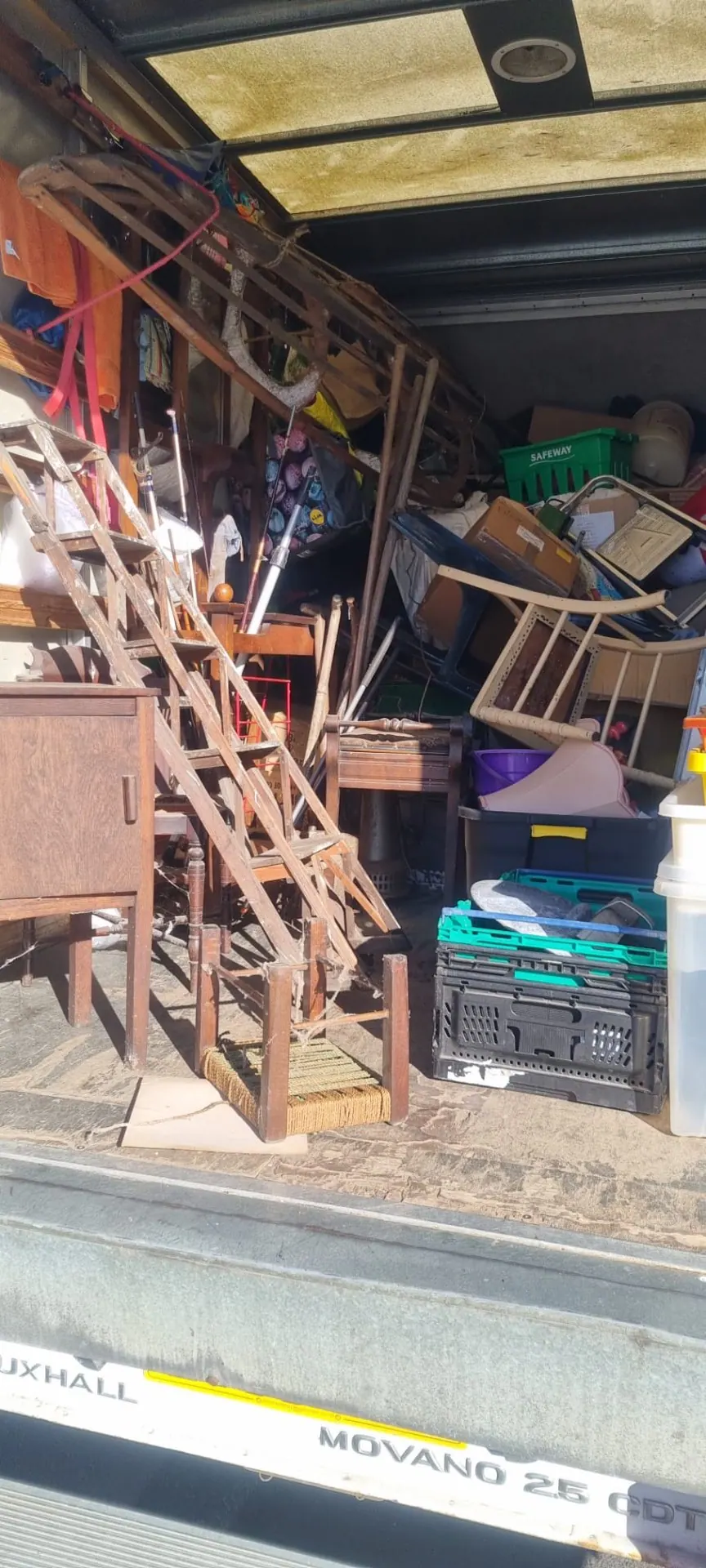 Van loaded with furniture from a house clearance